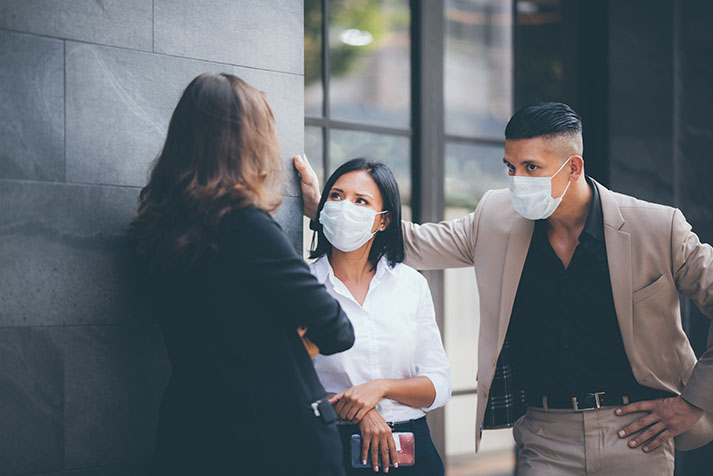 business people meeting with mask to prevent the spread of the virus covid19