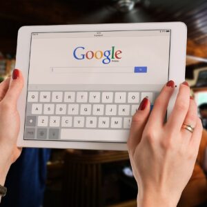 woman holding ipad