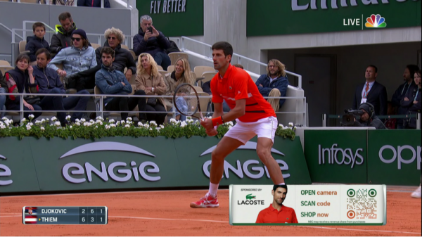 the tennis player Djokovic during a match with a scannable TV QR code present on screen