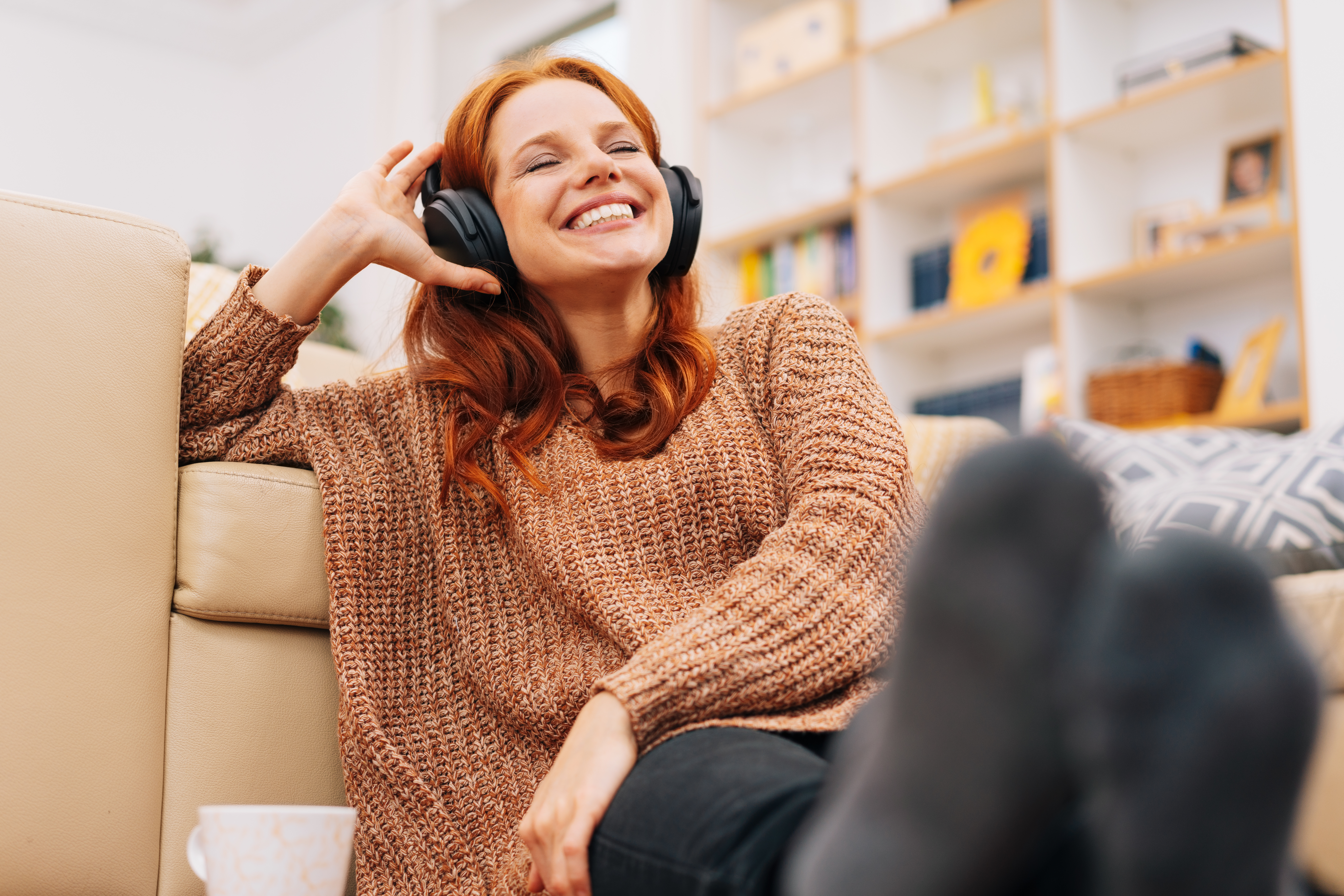Woman happily listening to podcast