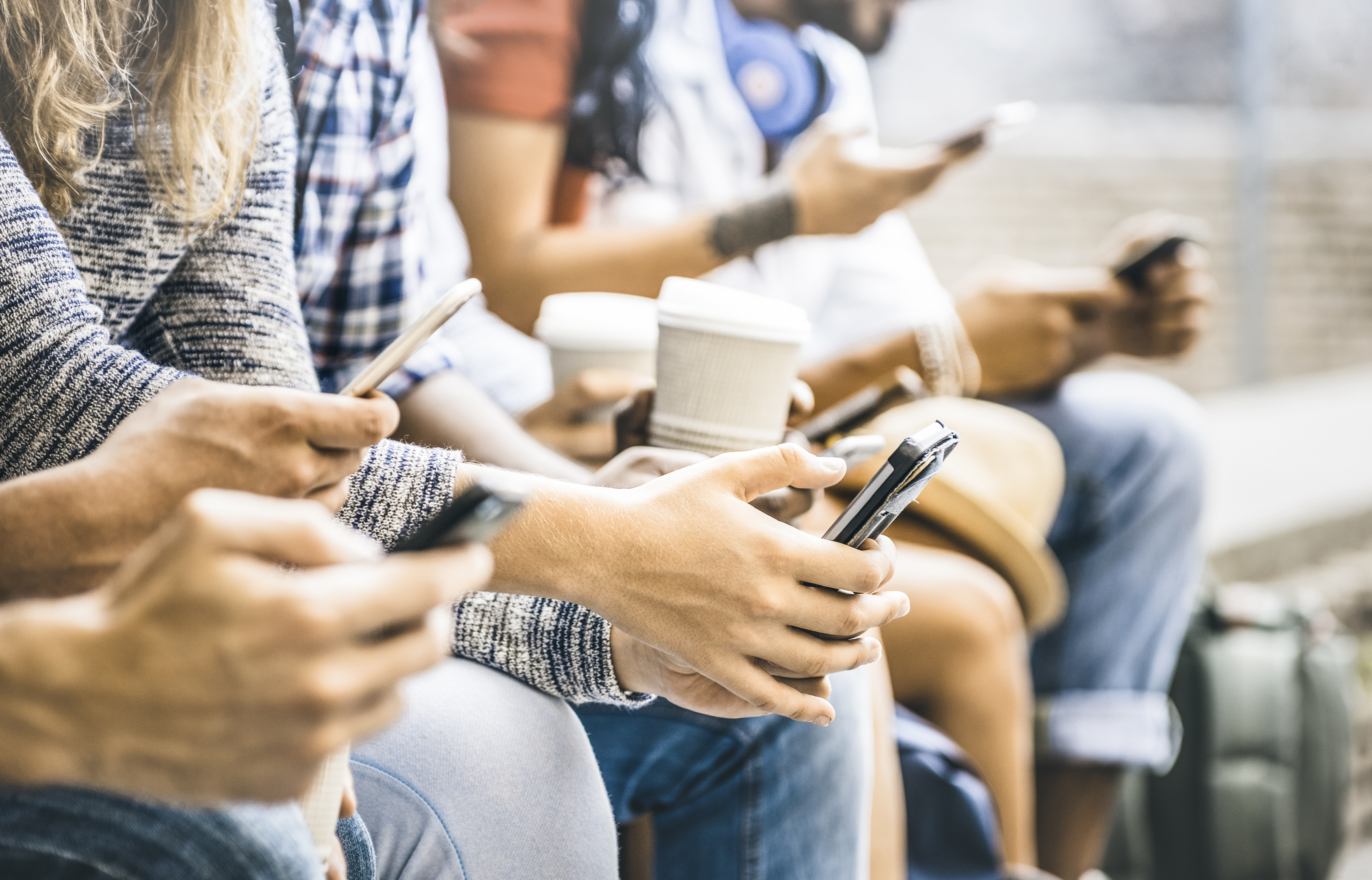 people on mobile devices watching social media video 