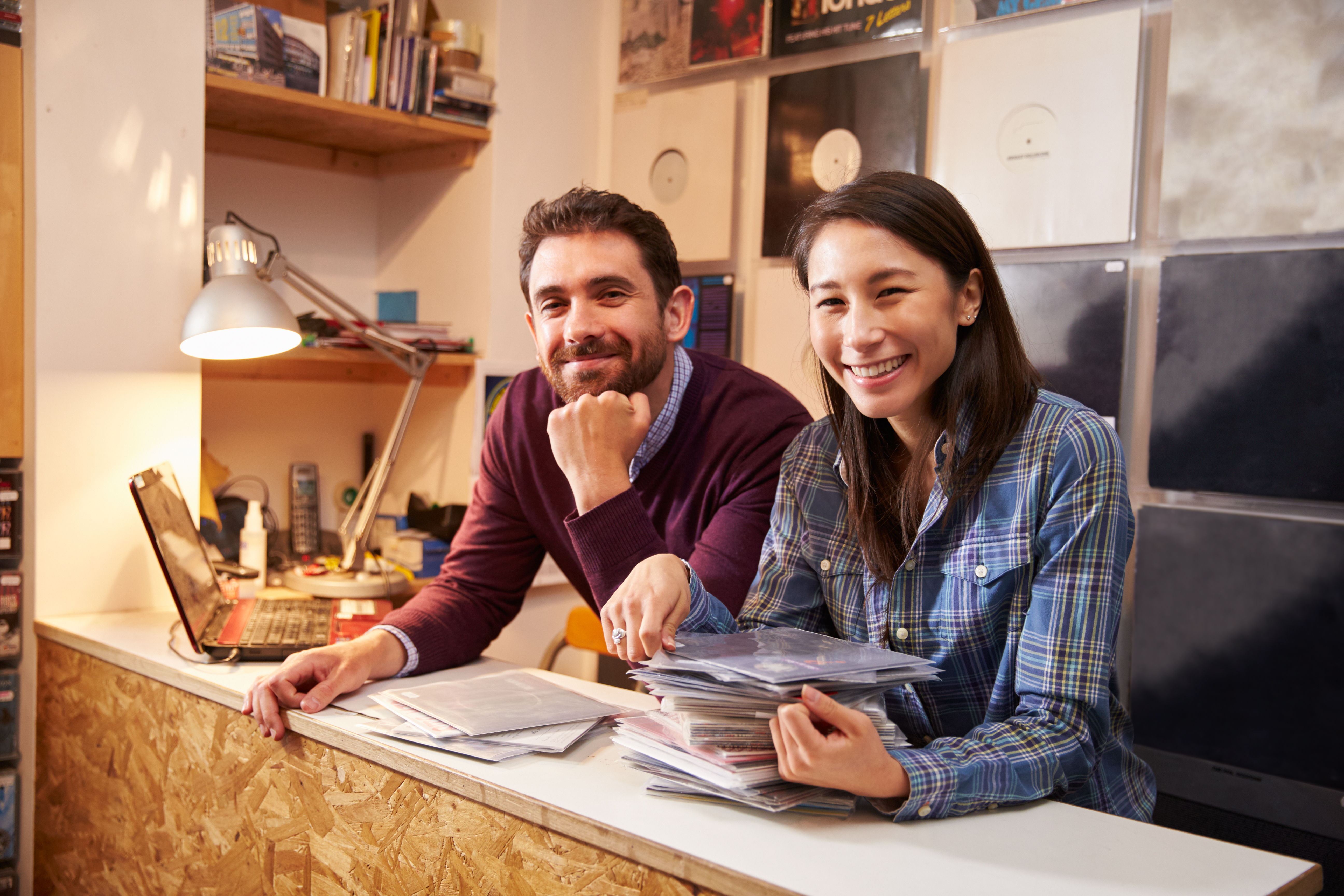 types of businesses - partnership, two people owning and running a record shop together.