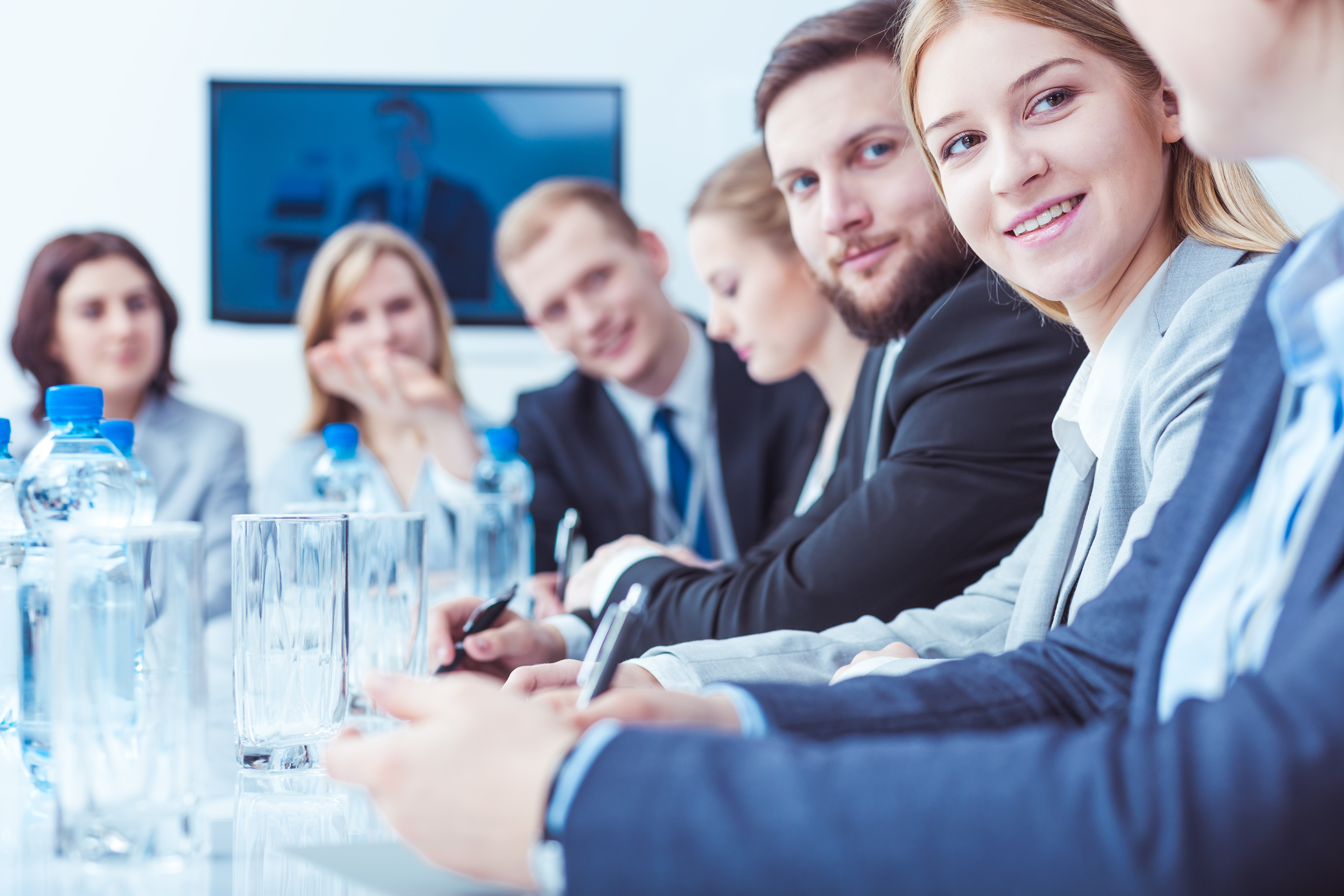 types of businesses -- people in business attire attending a stockholders meeting