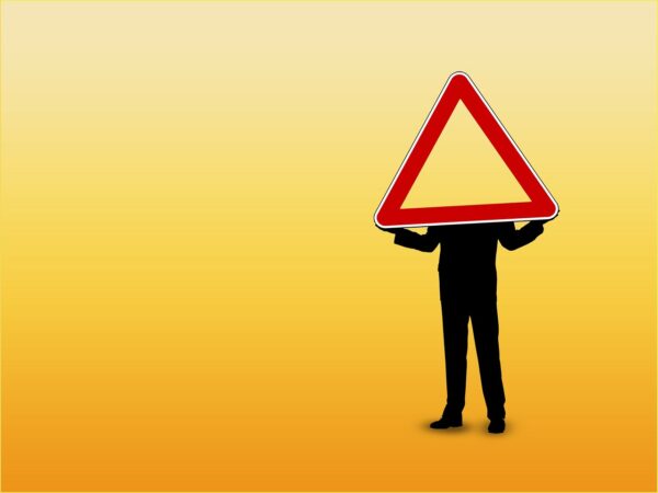 Man with warning sign