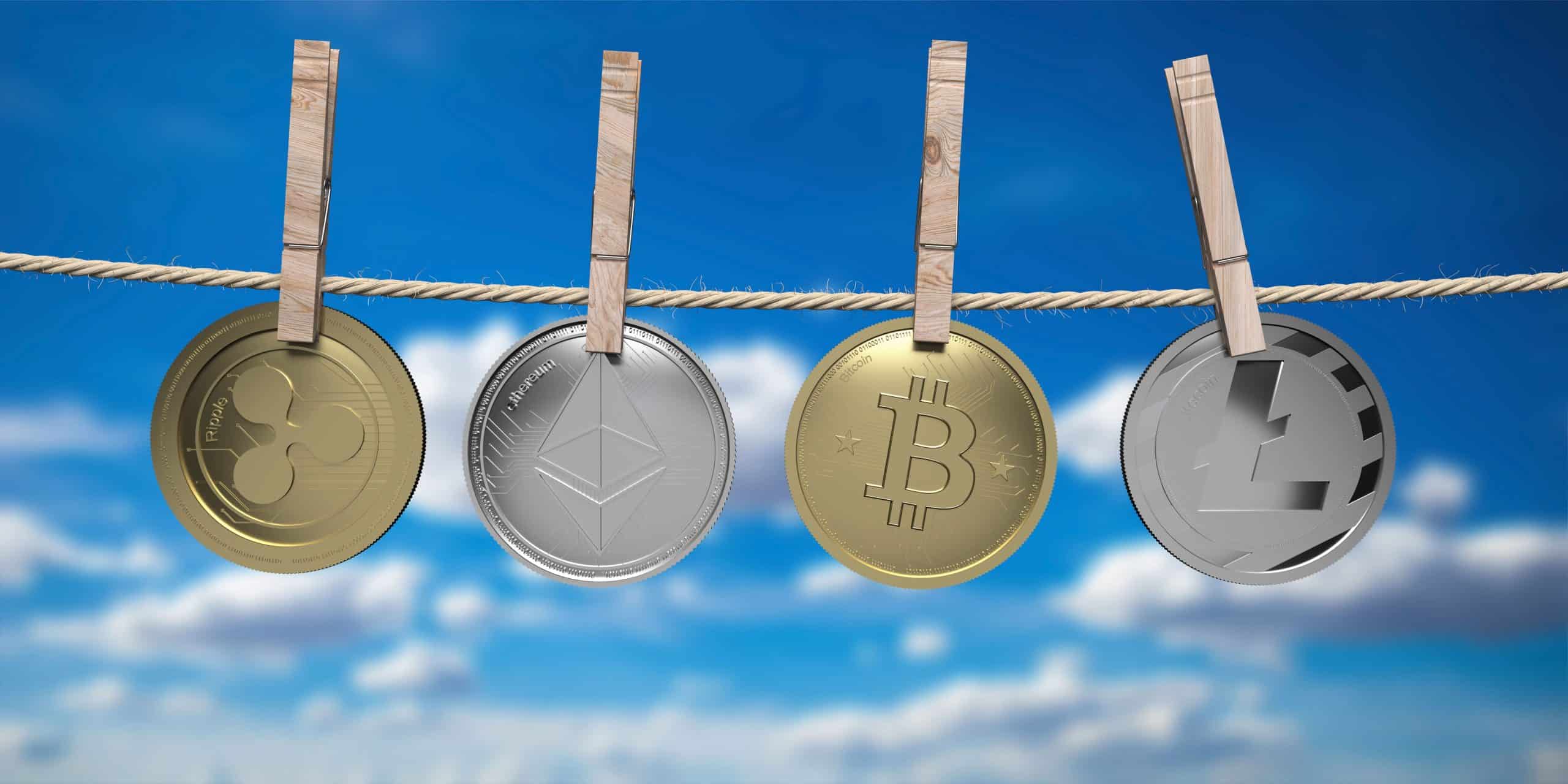 crypto coins on string with sky background