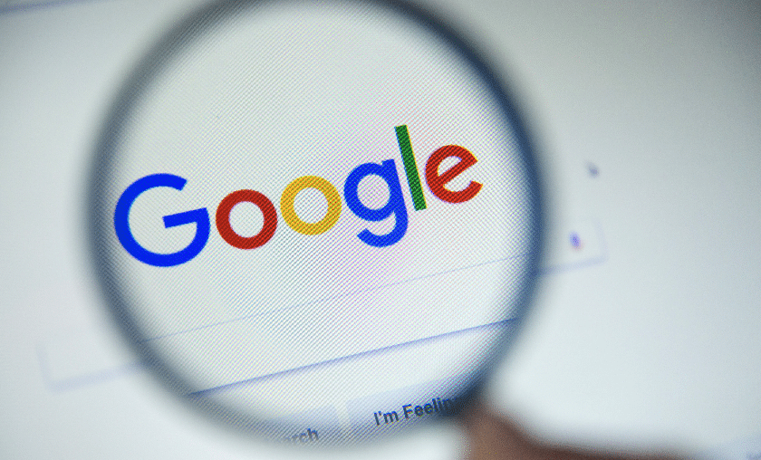 Google logo under magnifying glass