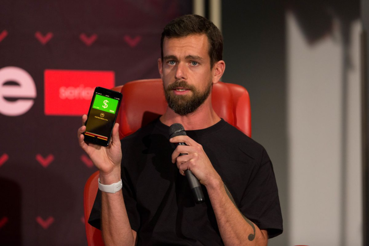 Jack Dorsey holding a phone