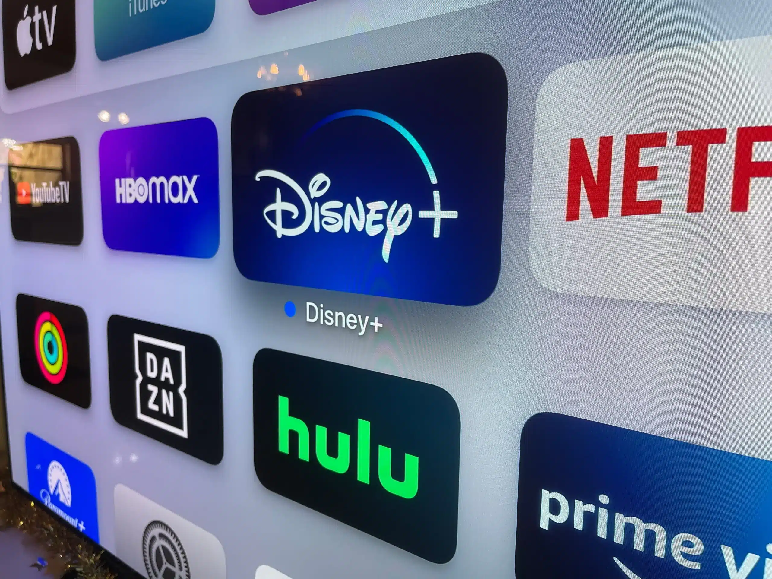 logos of multiple streaming platforms including disney displayed on a smart tv