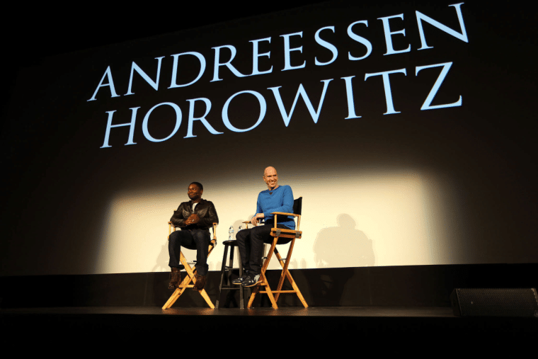 Marc Andreessen speaking with a colleague
