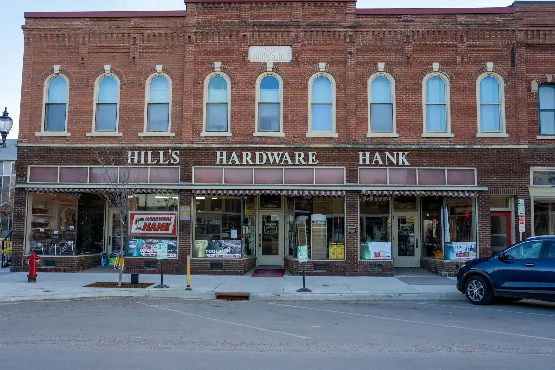 Closed hardware store with 'Hill's Hardware Hank' on its storefront.
